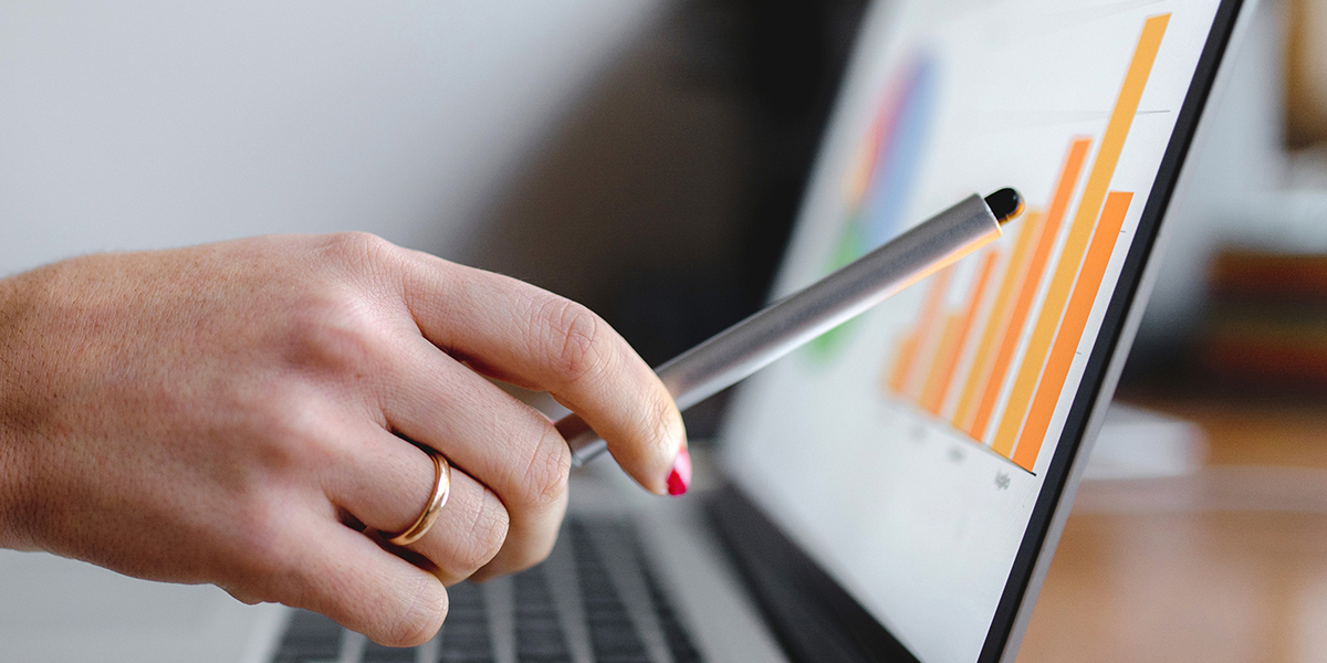 Sales person pointing to a screen with a Sales CRM