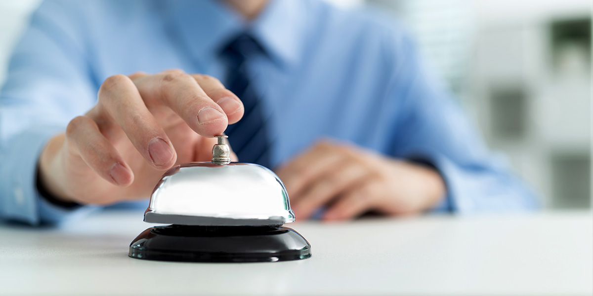 Person ringing bell for service.