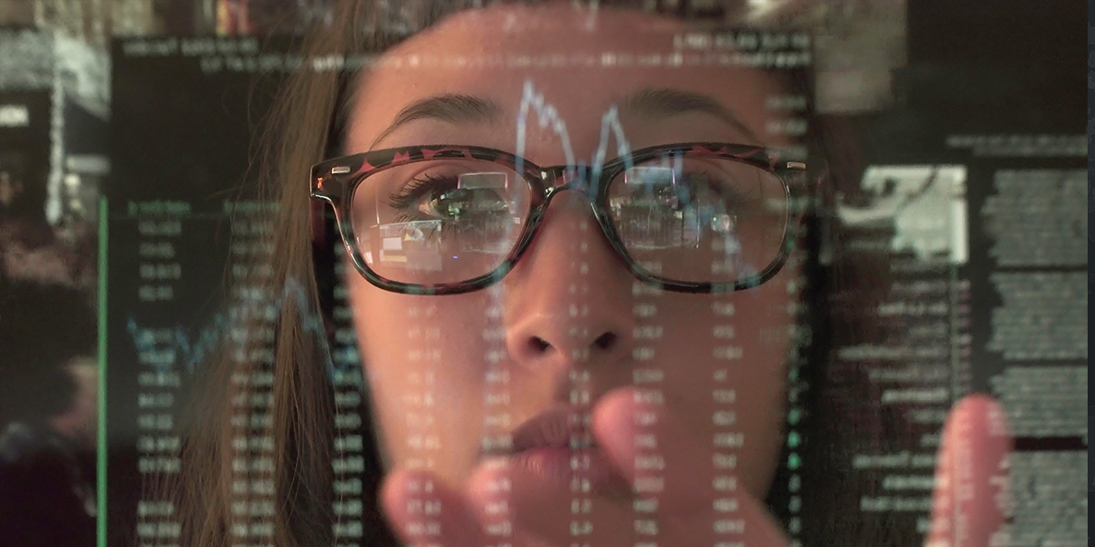 Woman looking into screen.